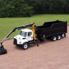 Debris removal truck manufactured by Ledwell featuring Rotobec Loader
