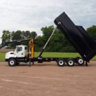 Debris removal dump truck manufactured by Ledwell featuring Rotobec Loader