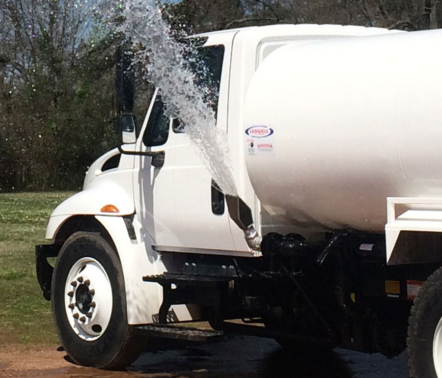 water truck with active side spray nozzle