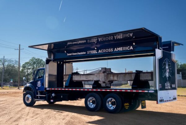 Custom Gull Wing truck transporting 9/11 steel beam